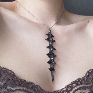 Gothic unique black spiky vertebrae necklace with a small silver chain